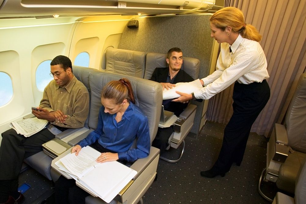 Flight Attendant Helping Passengers